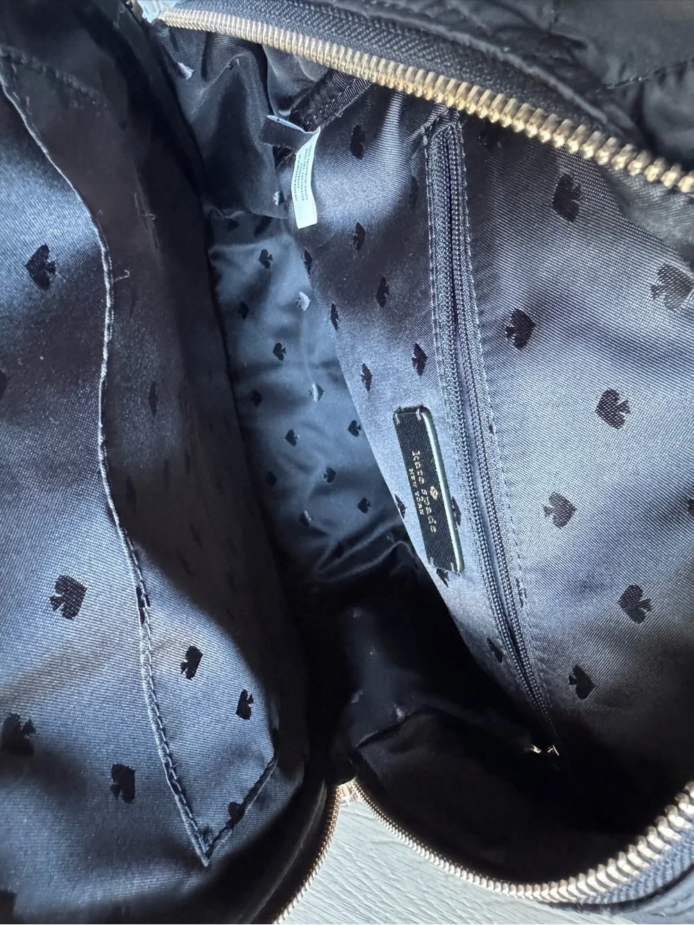 kate spade black quilted  backpack